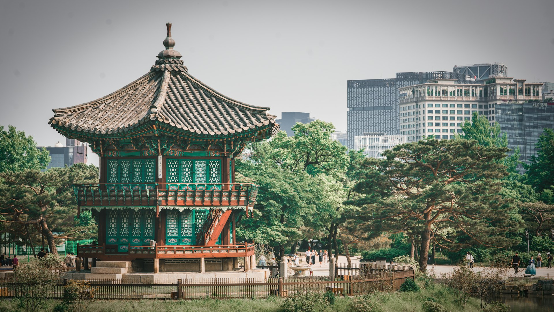 a tall building sitting in the middle of a park